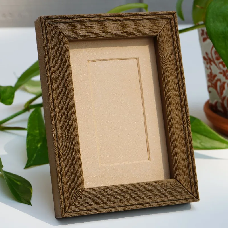 A printed wood grain frame with a hand-drawn reverse cascade edge relief