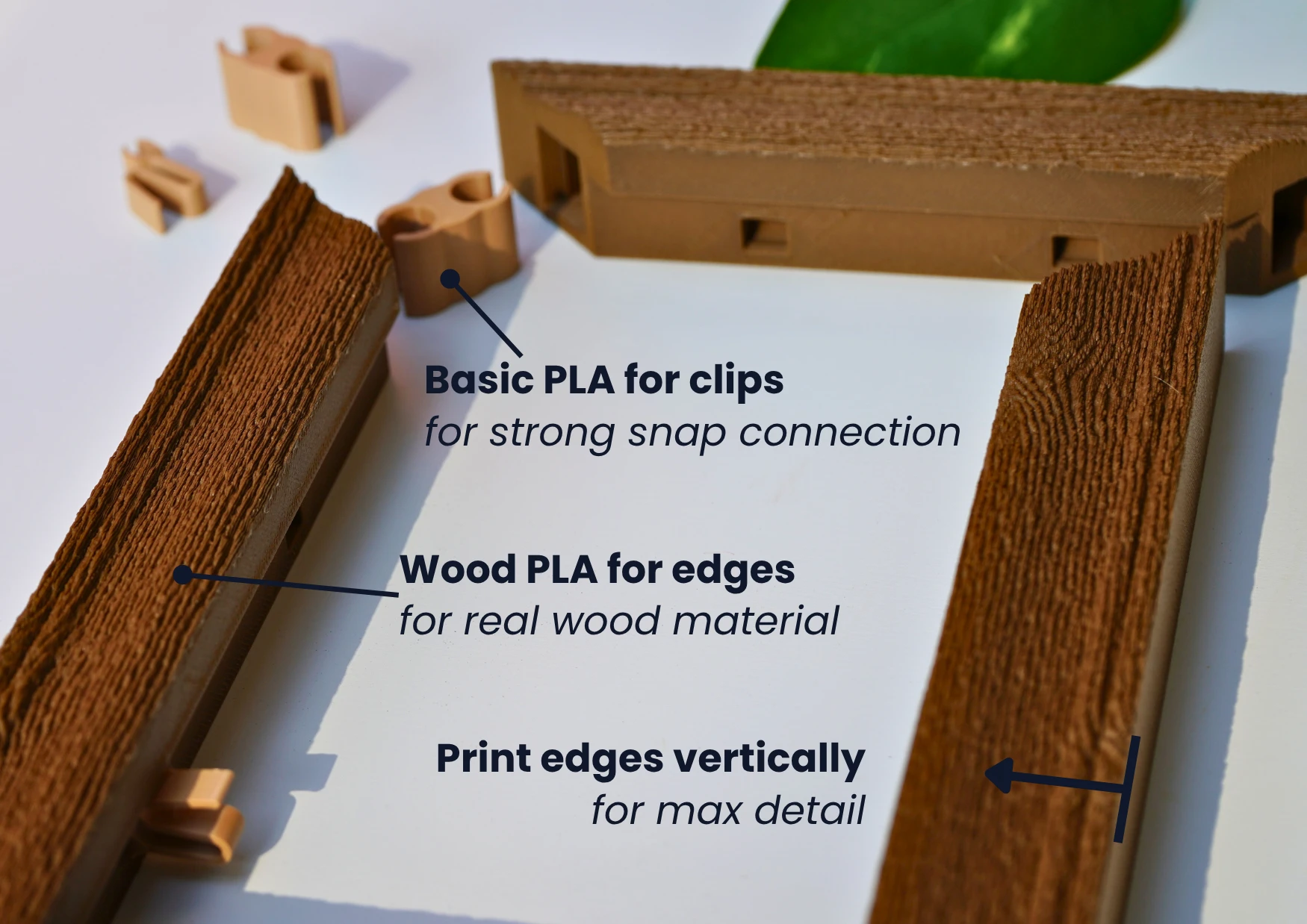 A wood-grain frame printed in wood PLA with basic PLA snap clips — basic PLA for clips (strong snap connection), wood PLA for edges (real wood material), and print edges vertically for max detail